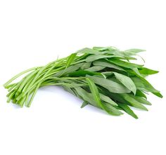 some green leaves are laying on the white surface, ready to be used in cooking