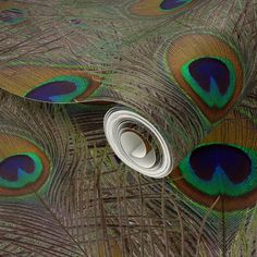 peacock feathers spread out on top of each other