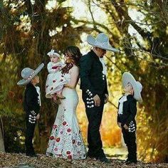 a couple and their children are dressed up in costumes