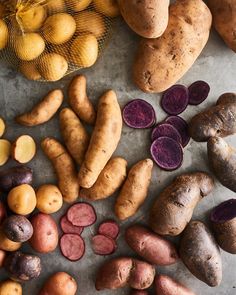 several different types of potatoes on a table