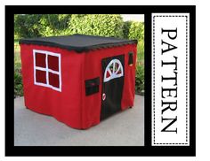 a little red house made out of felt with windows and doors on the front side