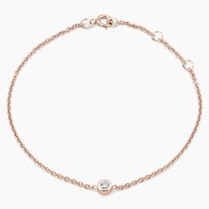 Diamond Bezel Bracelet - 14K Rose Gold. Both elegant and timeless, this bracelet features a scintillating bezel-set diamond on a delicate cable chain. The length of the bracelet can be adjusted from 6 to 7 inches to suit individual preference (1/10 total carat weight). Delicate Chain Diamond Bracelet In Rose Gold, Rose Gold Diamond Bracelet With Delicate Chain, Classic Rose Gold Bracelet With Single Diamond, Rose Gold Bracelet With Delicate Chain For Formal Occasions, Timeless Rose Gold Diamond Bracelet With Single Diamond, Rose Gold Diamond Bracelet For Formal Occasions, Formal Rose Gold Diamond Bracelet With Single Diamond, Timeless Rose Gold Diamond Bracelet With Prong Setting, Rose Gold Diamond Bracelet With Single Diamond