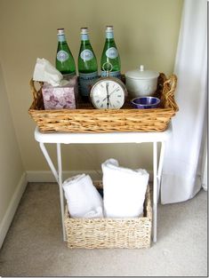 a wicker basket with towels and bottles on it