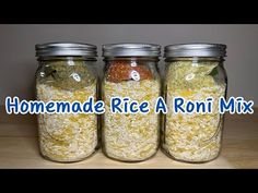 three jars filled with rice sitting on top of a table