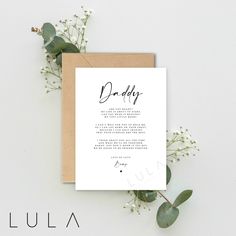 a card with the words daddy written in black ink on it next to some flowers