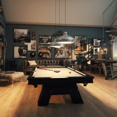 a pool table in a room with pictures on the wall