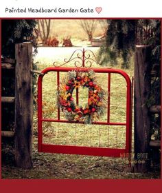 a red gate with a wreath on it