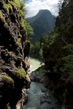 a river flowing between two rocky mountains