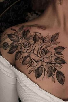 a woman's shoulder with flowers on it