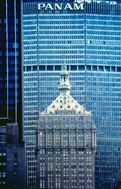 the pan am building is reflected in its windows