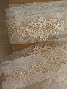 two pieces of cloth with lace on them