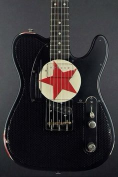 an electric guitar with a red star on it