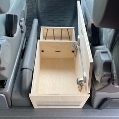 an open drawer in the trunk of a car