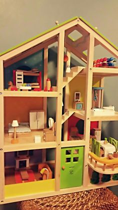 a doll house with lots of furniture and accessories