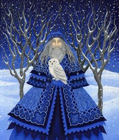 an owl is sitting on top of a blue dress in front of some trees and snow