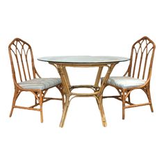 Two Henry Link cathedral bamboo dining chairs with bamboo round and glass top dining table. Cute lightweight set for a sunny dining nook. Perfect f… Beach House Chairs, Bamboo Dining Chairs, Dining Table Chair, Fabric Glass, Glass Top Dining Table, Tan Fabric, Dining Nook, Table Chair, Table And Chair Sets