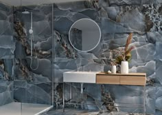 a modern bathroom with marble walls and flooring