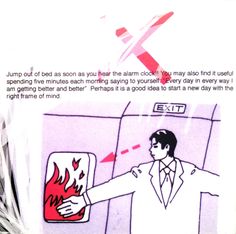 a man in a white suit and tie pointing at a red fire extinguisher