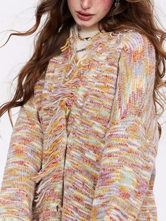 This is perfect for those who are looking for a clothing for a good price. It is fashionable, stylish, and it will look great on anyone who wears it. Do you wanahavit? Fringe V-neck Top For Fall, Spring Fringe Long Sleeve Cardigan, Spring Long Sleeve Fringe Cardigan, Multicolor Spring Outerwear With Tassels, Spring Multicolor Outerwear With Tassels, Fall Knit Tops With Fringe, Knit Fringe Top For Fall, Knit Top With Fringe For Fall, Winter Long Sleeve Tops With Tassels