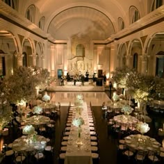 an indoor wedding venue with tables and chairs