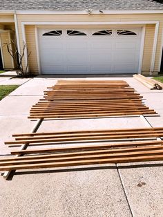 several wooden slats are lined up in front of a garage with a white door