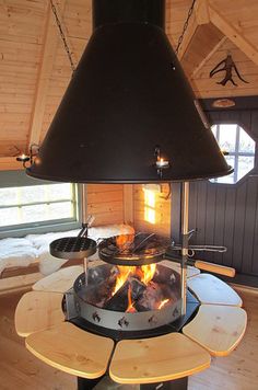 a fire pit in the middle of a room