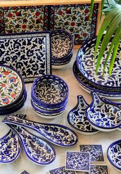 many blue and white dishes are on the table