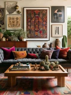 a living room filled with furniture and lots of pictures on the wall above it's coffee table