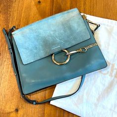 Suede Lining Has Marks And Stains. Corner Wear On One Side. Indentations On Exterior, Small Scratches On Suede Flap And Front Leather. 12.5”W X 10"H X 3"D. Dustbag Included. Chloe Faye Bag Blue, Chloe Bag, Chloe, Dust Bag, 3 D, Bag Lady, Shoulder Bag, Blue, Leather