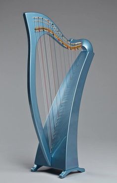 a blue harp with gold strings on a gray background