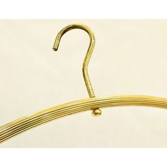 a close up of a gold colored metal hanger