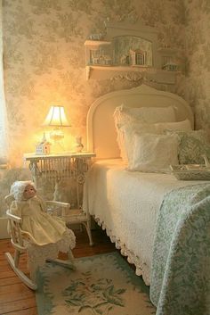 a small child's room with a rocking chair and large wall papered walls