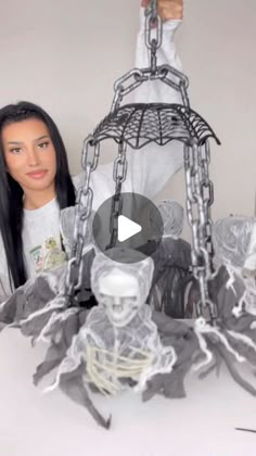 a doll is standing next to a fake skeleton