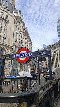 there is a sign that says underground on the side of the road in london, england