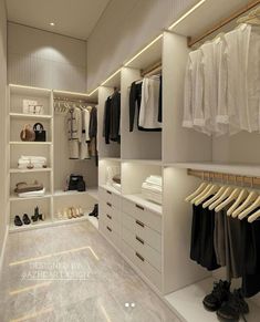 a walk in closet filled with lots of clothes