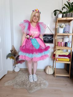 a woman in a pink and blue costume