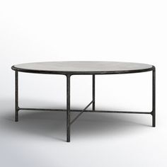 an oval table with black metal frame and marble top, viewed from the front angle