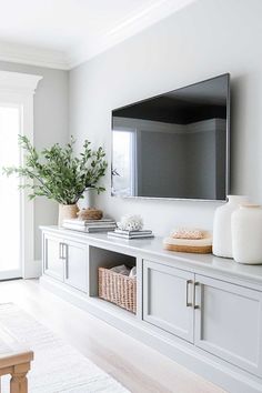 25+ Grey TV Cabinet Design for Living Room Creations That’ll Be the Real Star of Movie Night Tv Storage Bench, Mounted Tv In Living Room, Furniture For Tv Wall, Mounted Tv With Storage, White Shiplap Tv Wall, Modern Farmhouse Tv Cabinet, Tv Wall With Cabinets Underneath, Tv On Big Wall Ideas, Living Room Decor With Tv On Wall