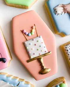 decorated cookies are arranged on top of each other