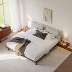 a bedroom with a large bed and two nightstands