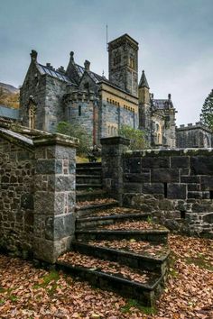 an old castle with stairs leading up to it