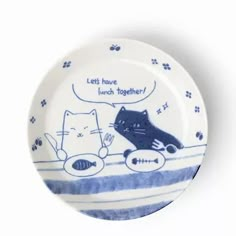 a blue and white plate with an image of two cats in the bathtub saying, let's have lunch together