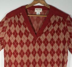 This sweet 1970's pullover textured harlequin print knit shirt is perfect for keeping it casual and still looking super fly and on trend!  This V neck top with baggy disco sleeves has a designer label, "Phyllis Sydney for Shaker Sport" that's collectible. You'll dig the texturized fuzzy and soft knit brick red and tan fabric and the cool V neck, square hem and long sleeve cut. Groovy. This retro top is in great vintage condition with no major damage. It has a size 40 on the label and flat measur 70s Tops Women Plus Size, 70s Short Sleeve Sweater, Harlequin Print, 70s Tops, Disco Style, Super Fly, Tan Fabric, Retro Tops, Designer Label