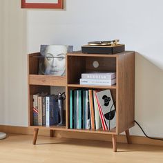 a book shelf with books and magazines on it