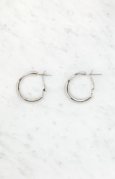 The LA Hearts Medium Basic Hoop Earrings provide timeless elegance with a versatile design, making them perfect for everyday wear and effortless style.


	Basic hoop design
	Gold finish
	Snap closure Everyday Metal Clip-on Hoop Earrings, Everyday Clip-on Metal Hoop Earrings, Classic Metal Hoop Earrings For Everyday, Small Metal Clip-on Hoop Earrings, Everyday Clip-on Hoop Earrings, Small Metal Hoop Earrings With Lever Back, Classic Nickel-free Metal Hoop Earrings, Small Metal Hoop Clip-on Earrings, Small Metal Hoop Earrings Clip-on