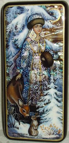 a decorative tile with a painting of a woman and a deer in the snow on it