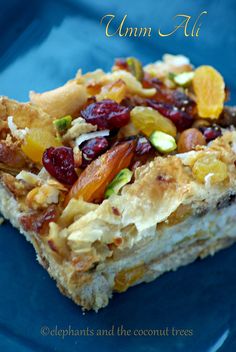 a blue plate topped with fruit and nuts