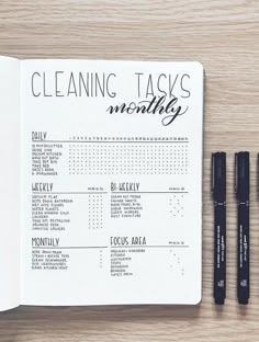 three black pens sitting on top of a paper with the words cleaning tasks written in it