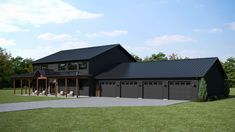 a large black house with two car garages