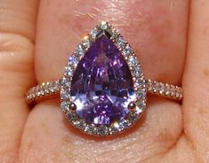 A beautiful and delicate engagement ring featuring a beautiful violet-purple Ceylon pear sapphire in a rose gold diamond halo. The center stone is a 2.05 carat sapphire from Sri Lanka. It measures 10.4x7.1mm and has a very pleasing pear cut. The sapphire is a very pretty violet purple color and very clean, truly a one-of-a-kind gem! It is either untreated or basic heat only, I can't tell exactly. The crystal is very nice and clean, giving it very nice luster and sparkle, be sure to check out the Purple Safire Ring, Purple Sapphire Ring Engagement, Purple Sapphire Ring Vintage, Saphire Engament Ring Purple, Purple Spinel Ring, Violet Engagement Ring, Purple Engagement Ring, Purple Sapphire Engagement Ring, Purple Diamond Ring